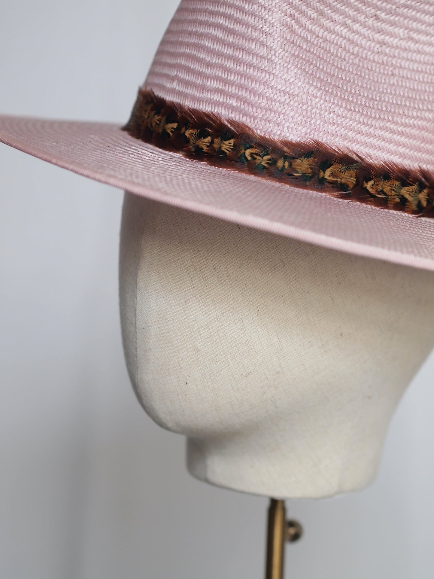 Pale pink straw fedora with two toned feather headband
