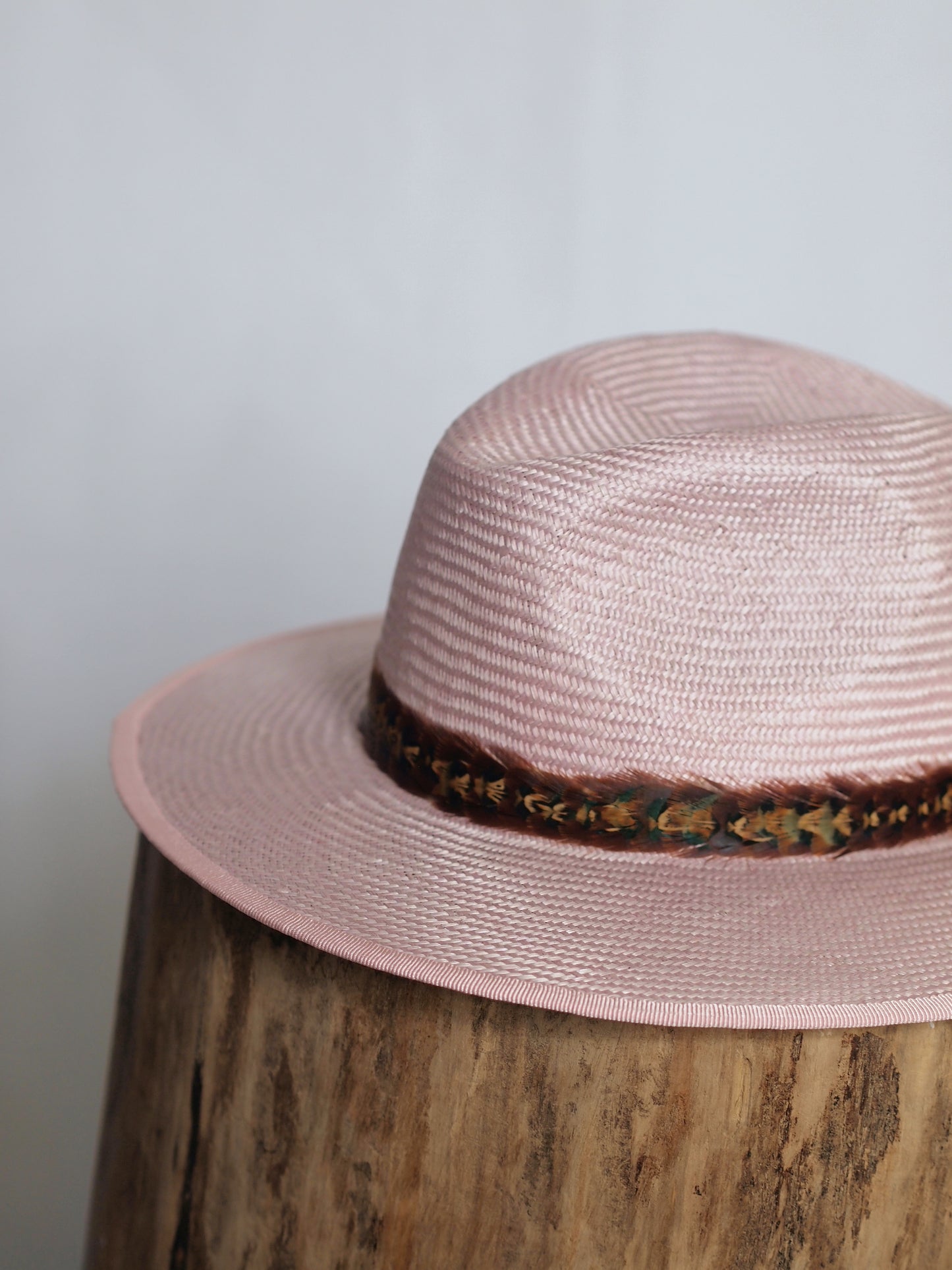 Pale pink straw fedora with two toned feather headband