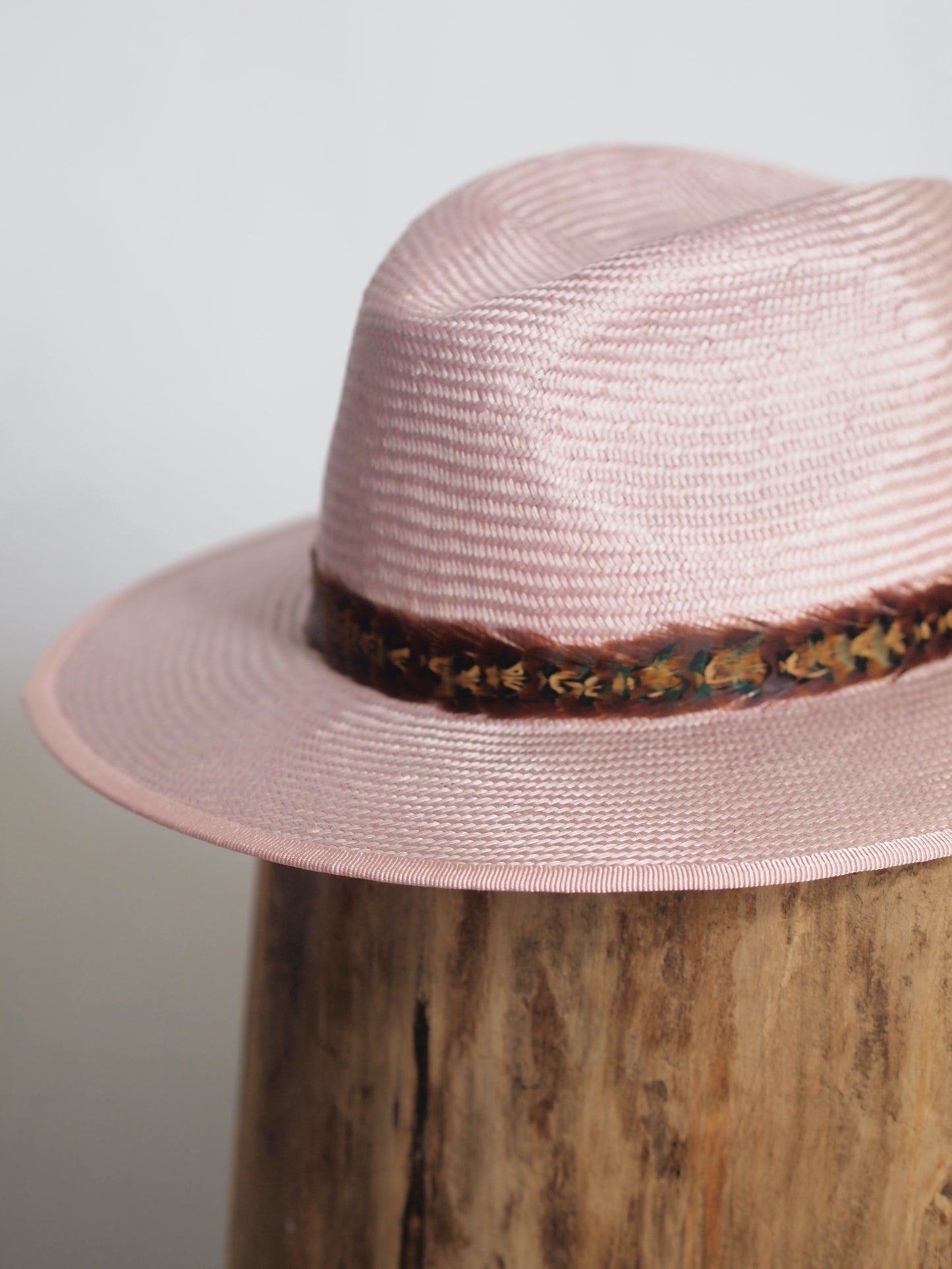 Pale pink straw fedora with two toned feather headband