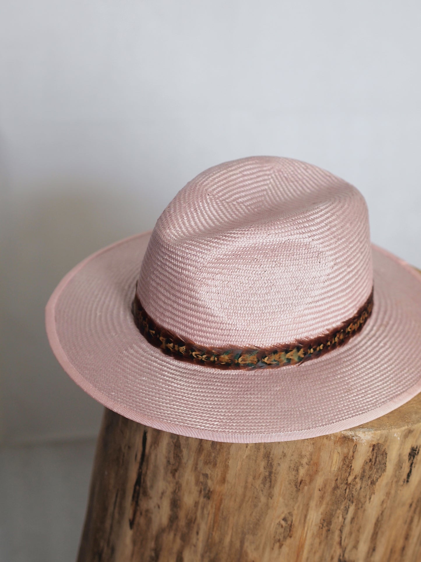 Pale pink straw fedora with two toned feather headband
