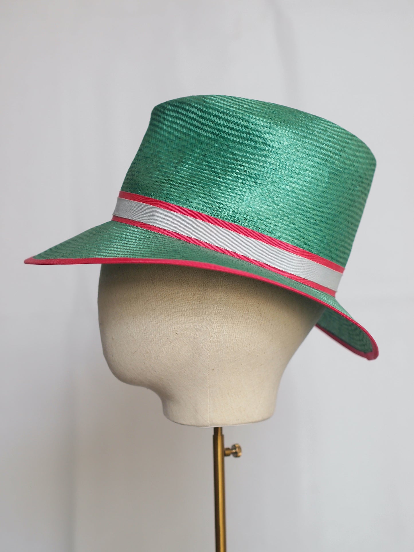 Green straw fedora with feather pom pom